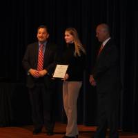 Woman standing with award